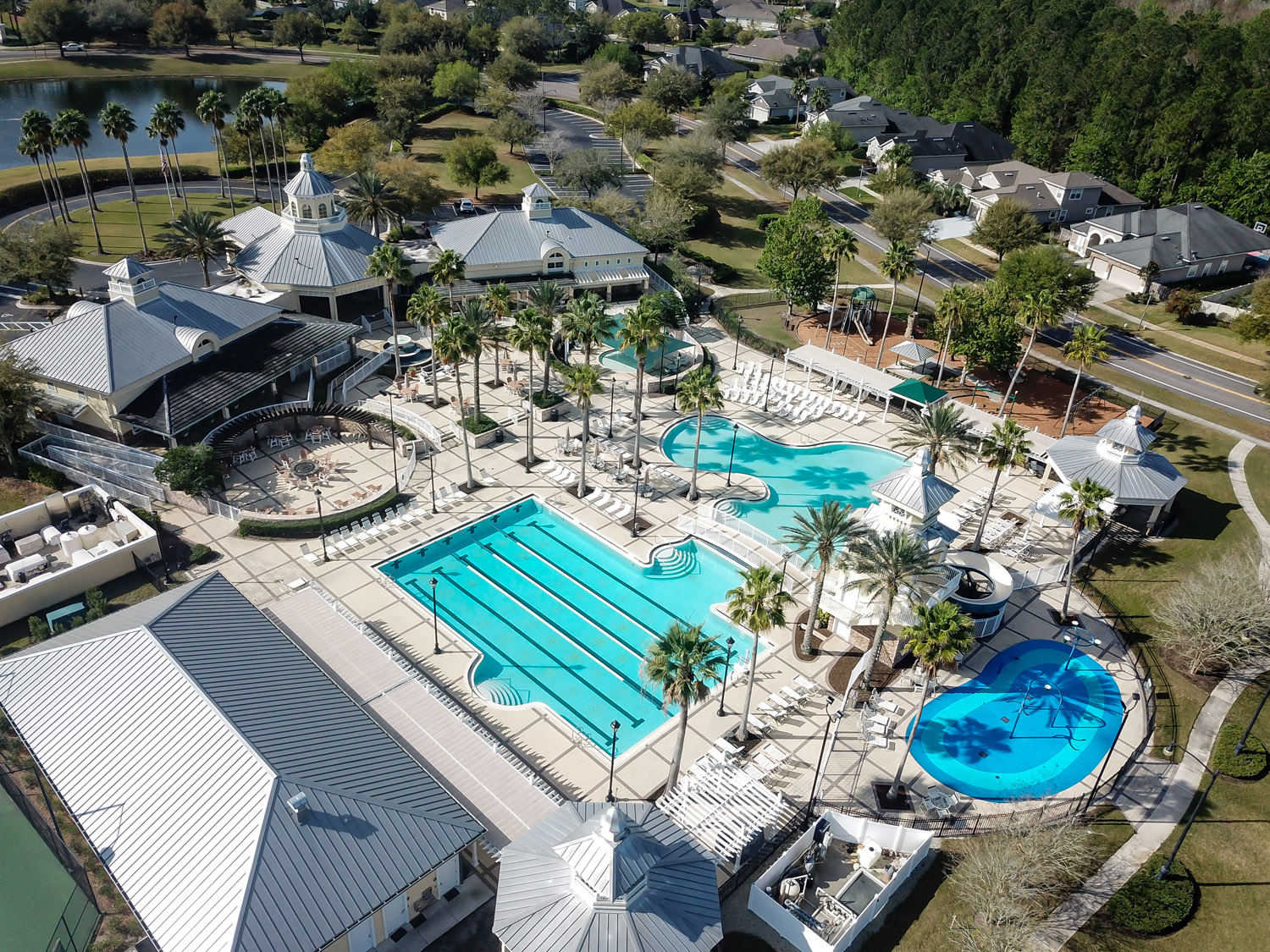 aerial view of community clubhouse and pool amenities
