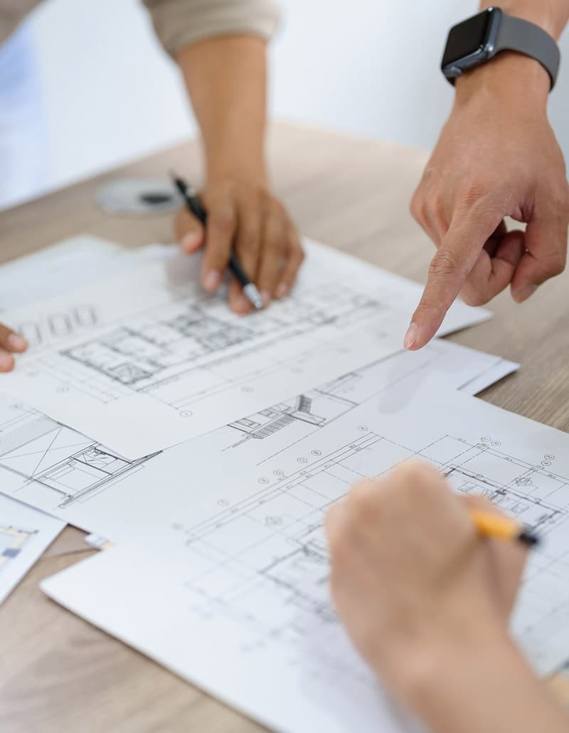 architect and client talking over blueprints