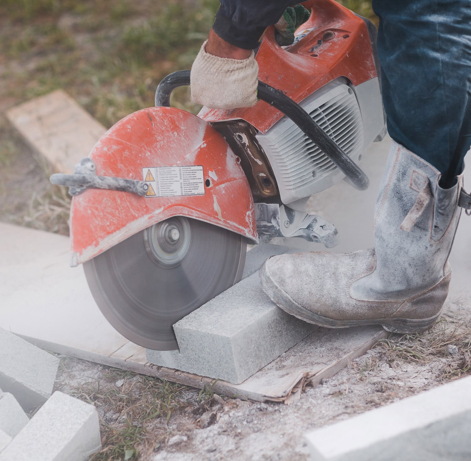 construction worker fixing neighborhood sidewalk