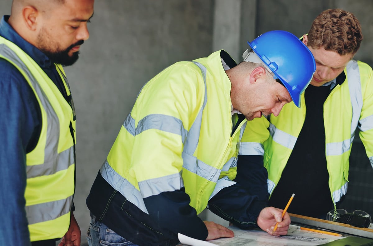 contractors checking blueprints