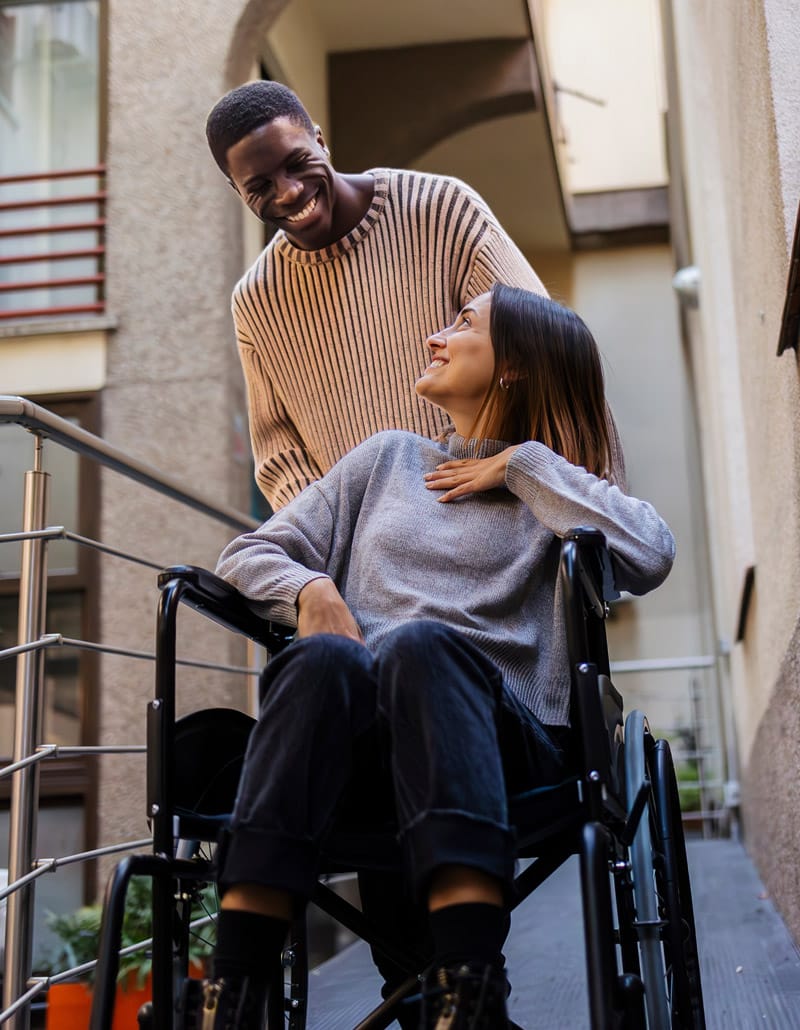 couple going down wheelchair ramp