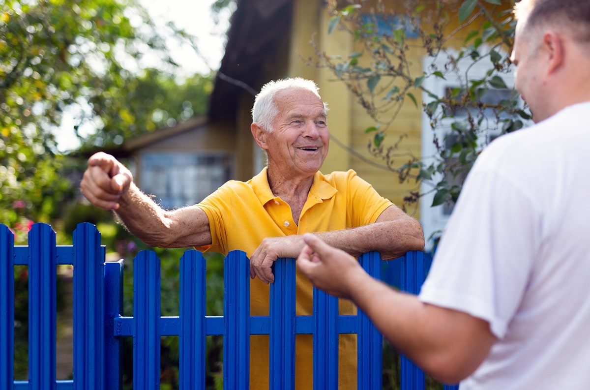 elderly community member talking to representative
