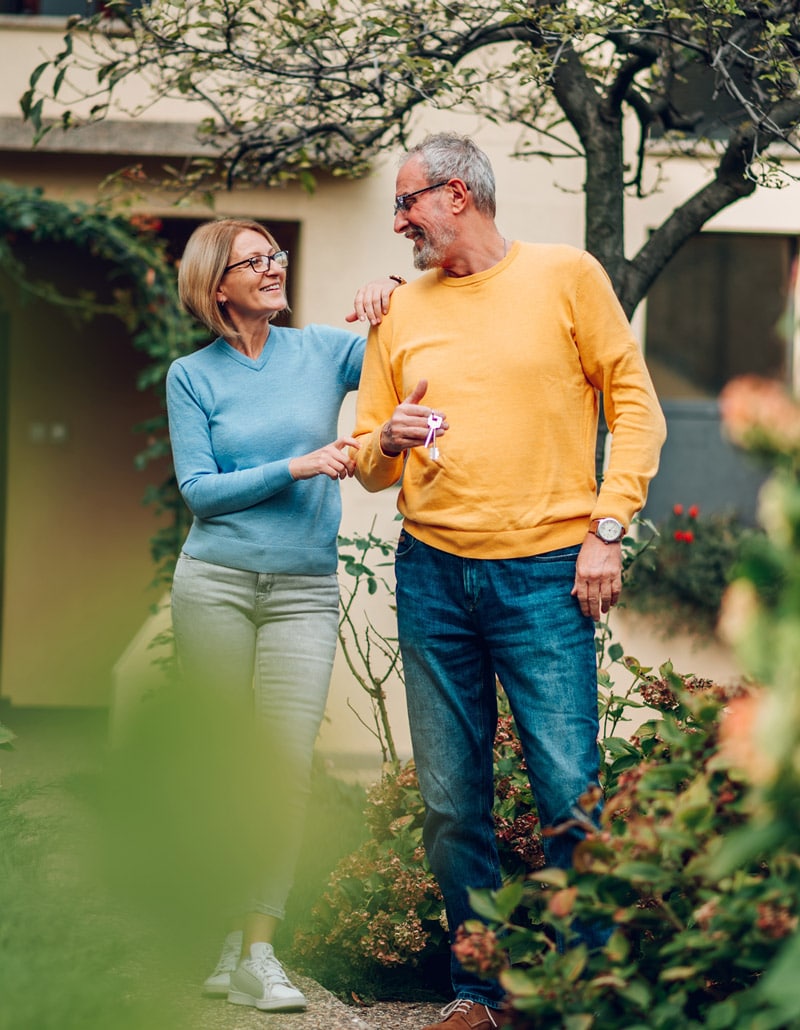 elderly couple talking in neighborhood