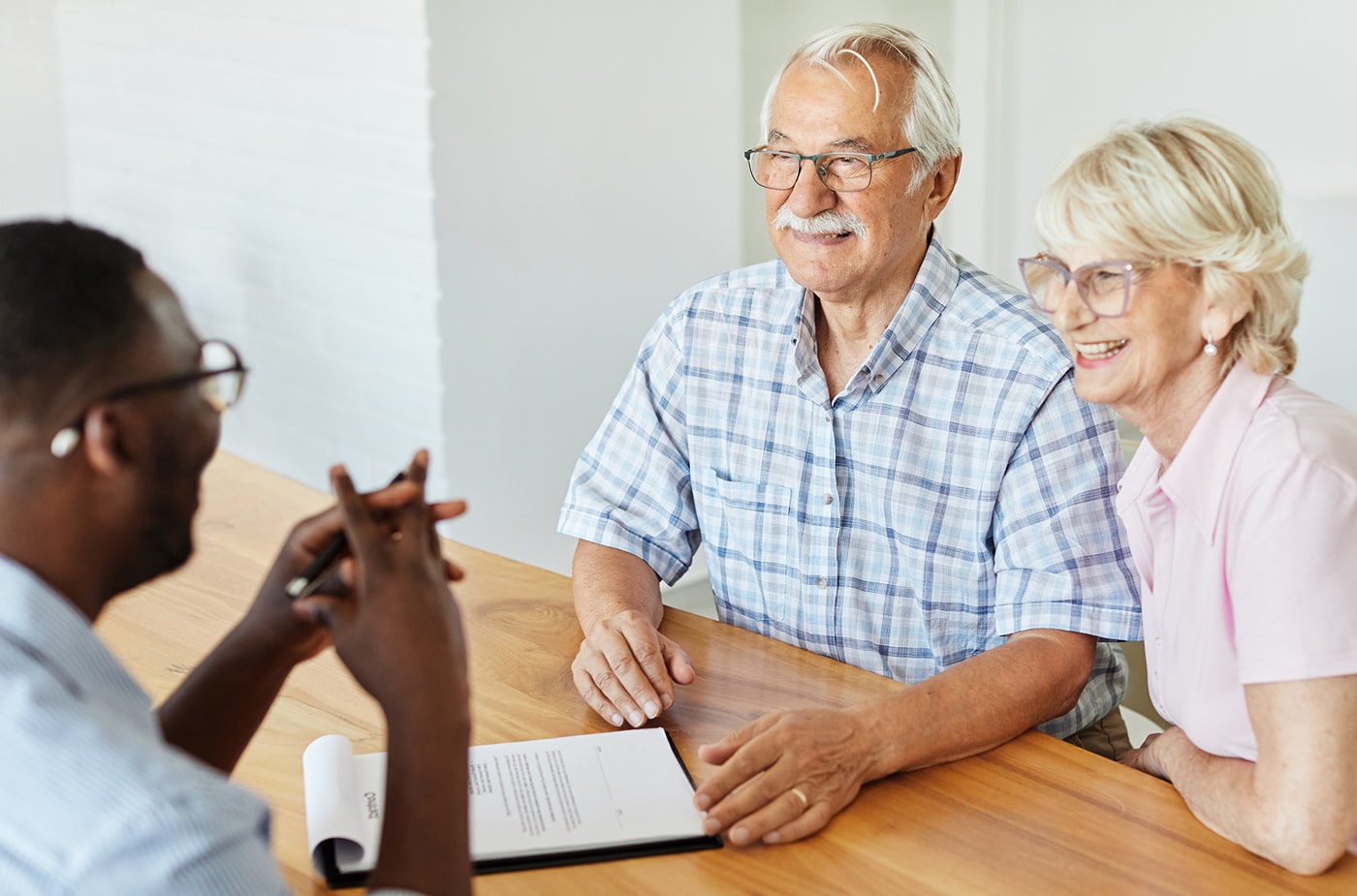 elderly couple talking to reserve fund manager