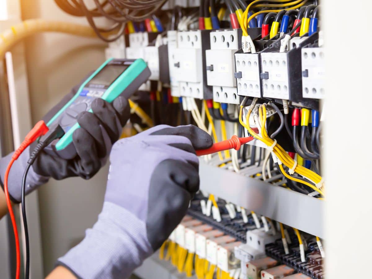 electrical maintenance worker fixing breaker cords
