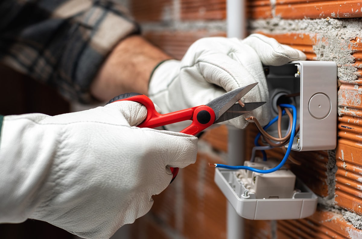 electrician fixing outlets