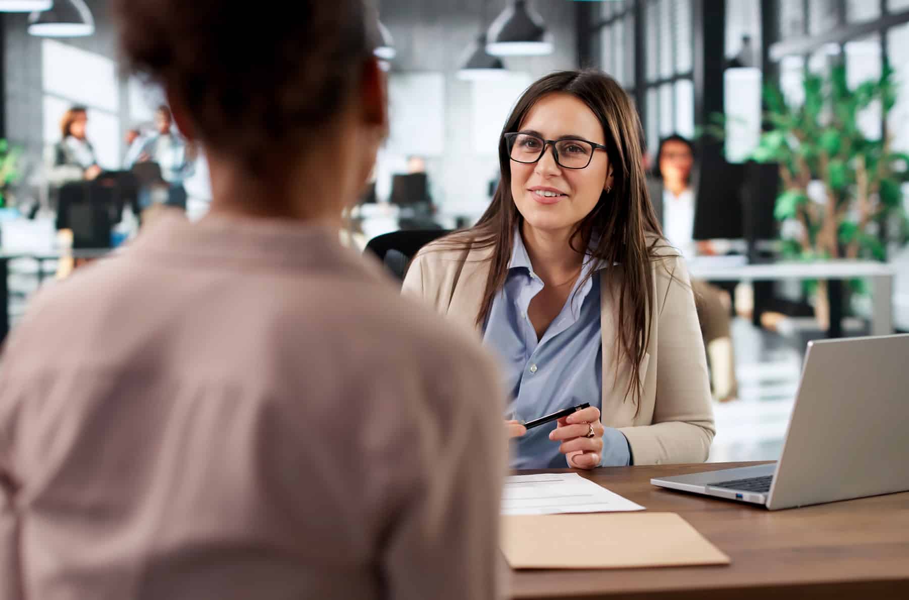 female association manager talking to vendor client