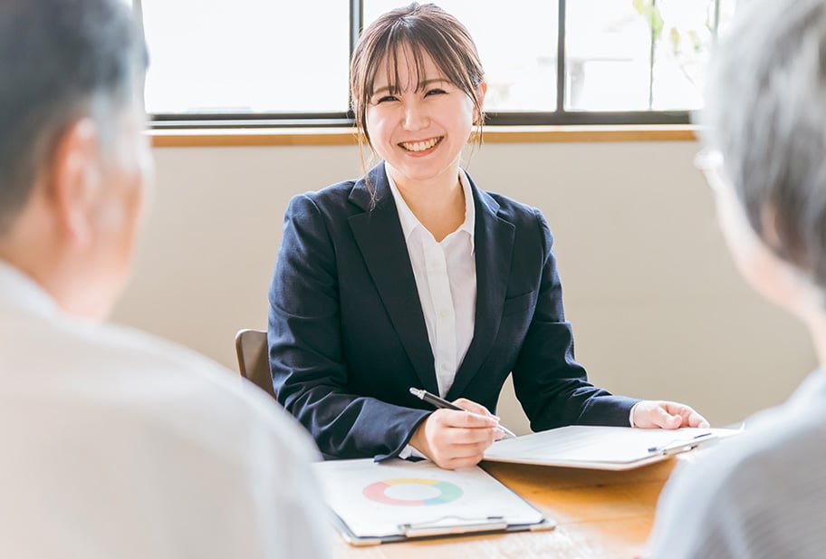 female insurance manager talking to client over terms