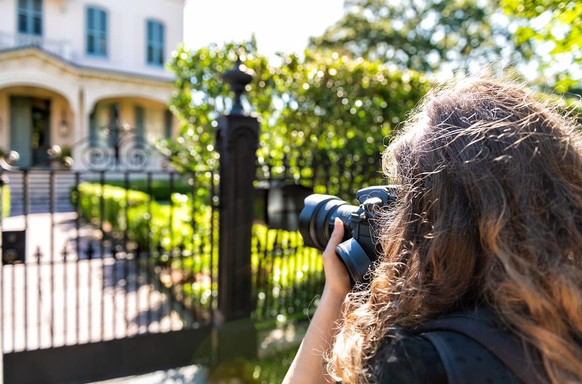 field photographer taking house photos