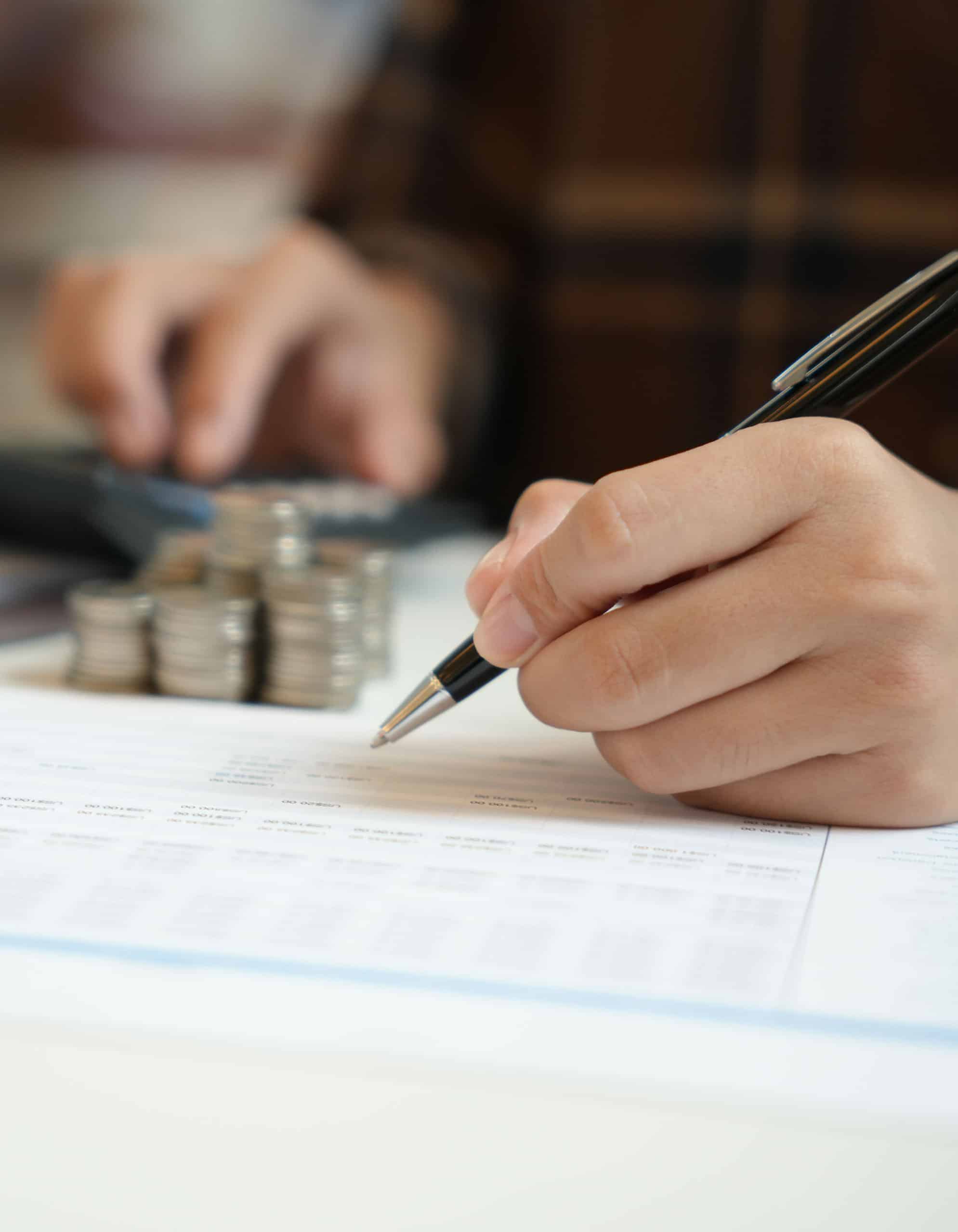 Man Calculating Community Financing