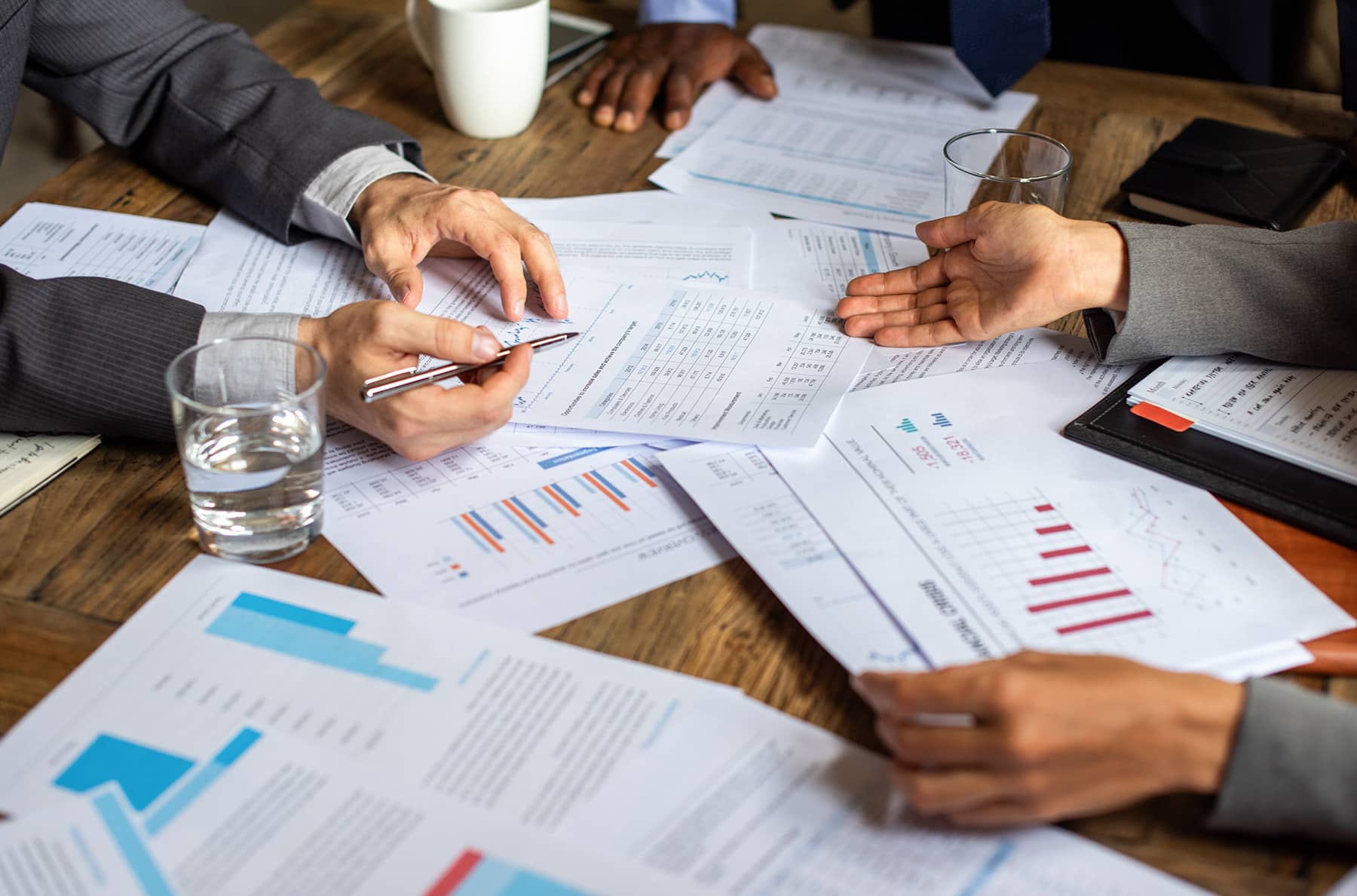 financial managers in meeting checking finances