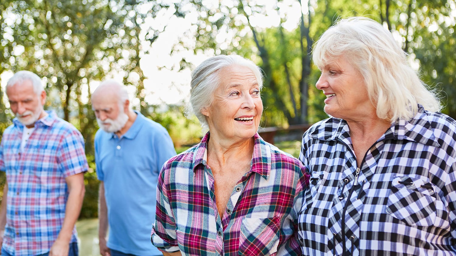 group of elderly residents talking to each other
