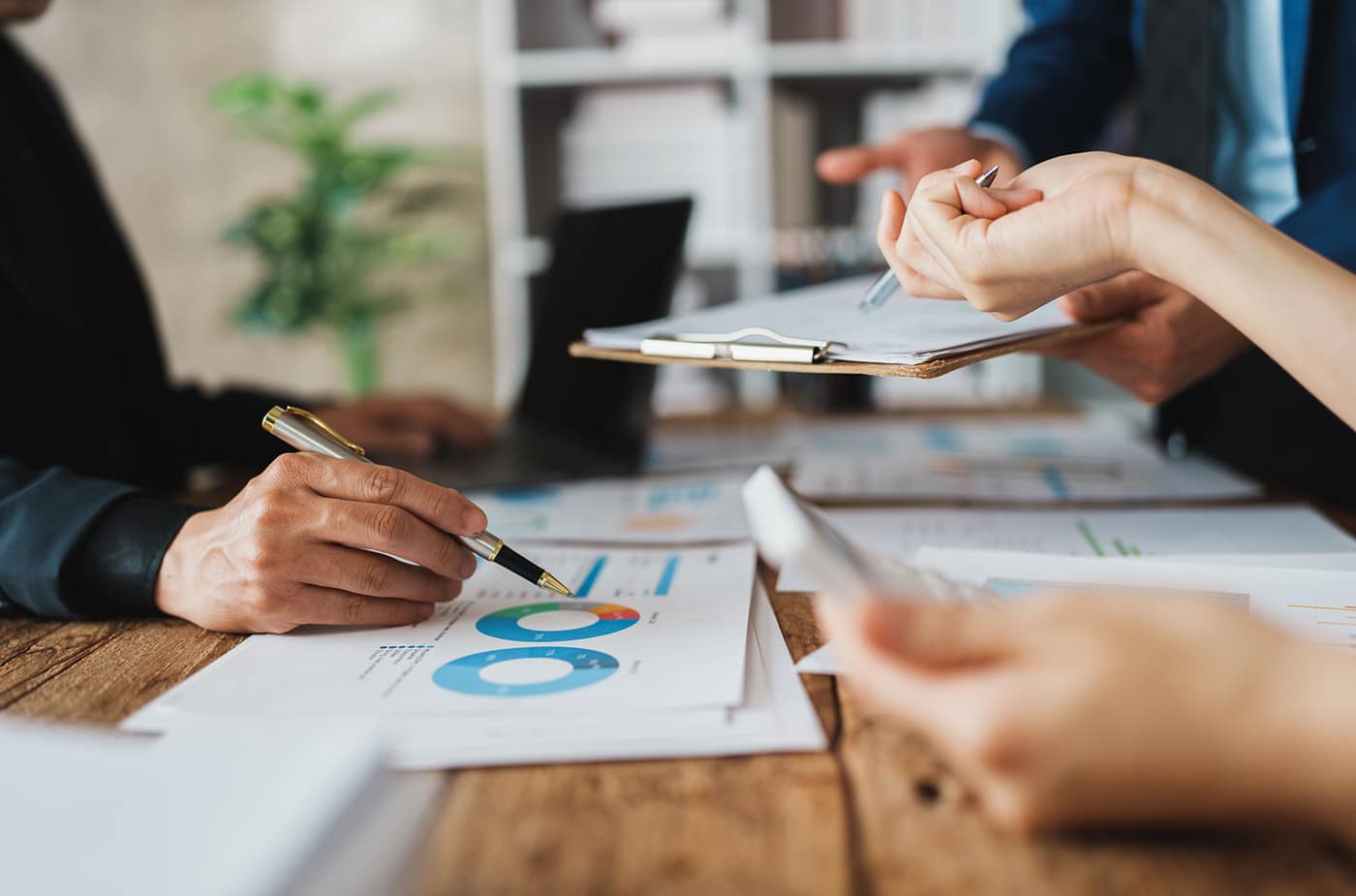 group of insurance managers checking finances
