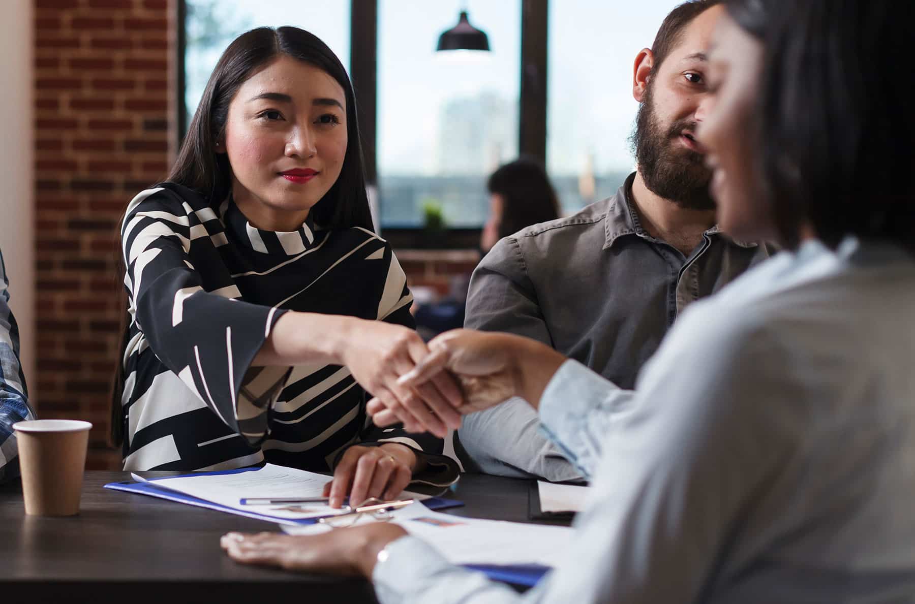 Woman Shaking Hands with HR Representative