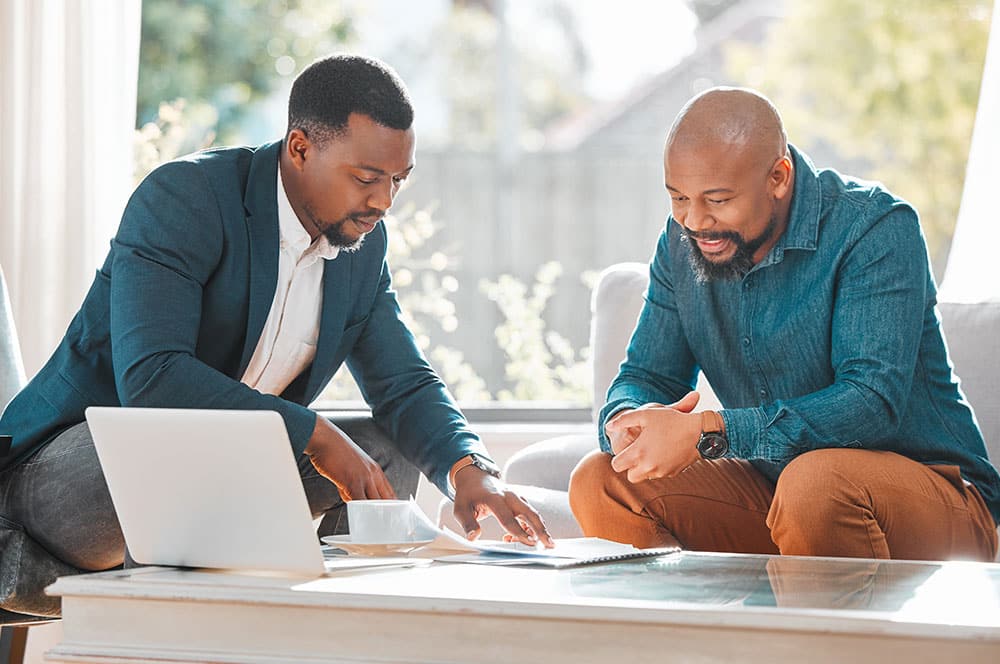 insurance broker talking policy with client