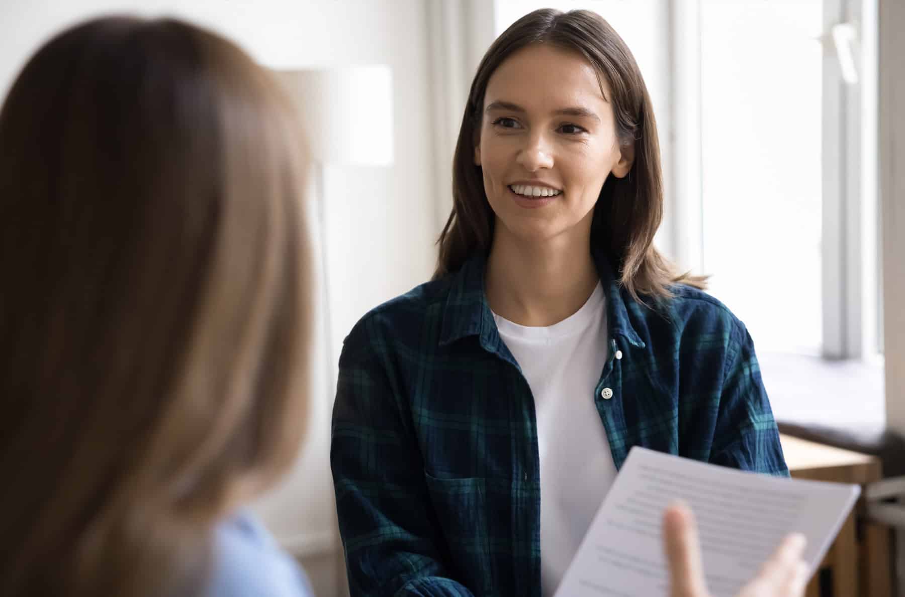 insurance client listening to insurance manager