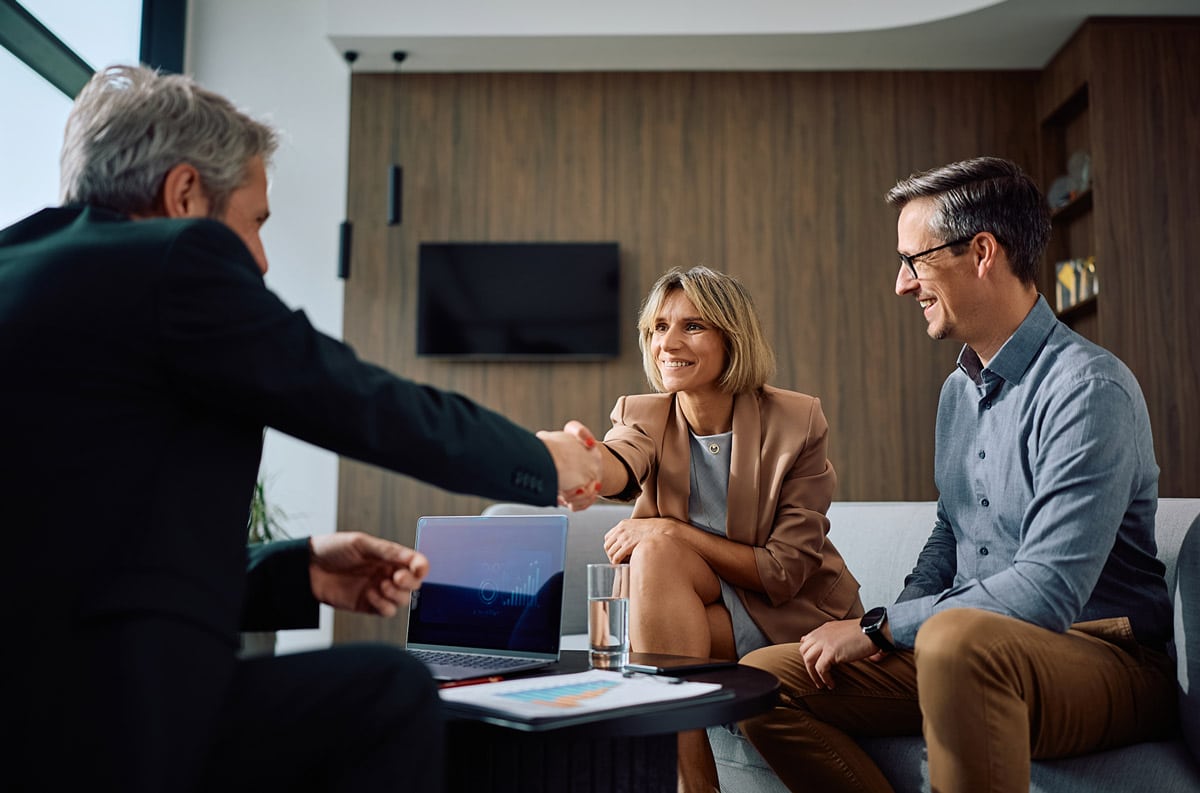 insurance manager shaking hand with client