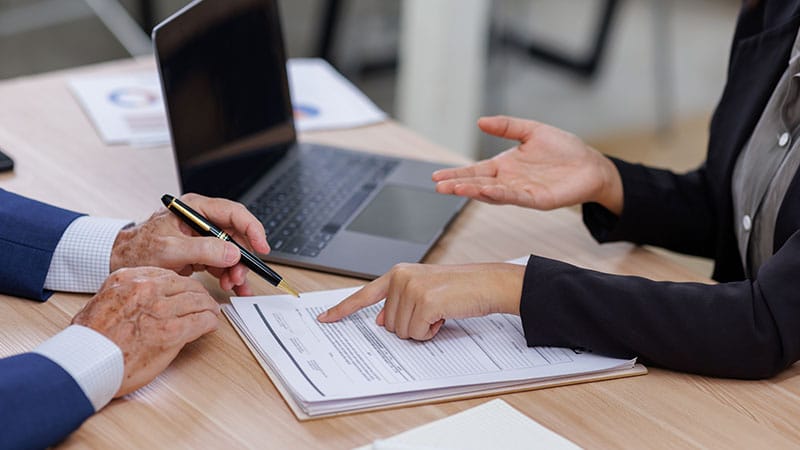 insurance manager talking to client over contract