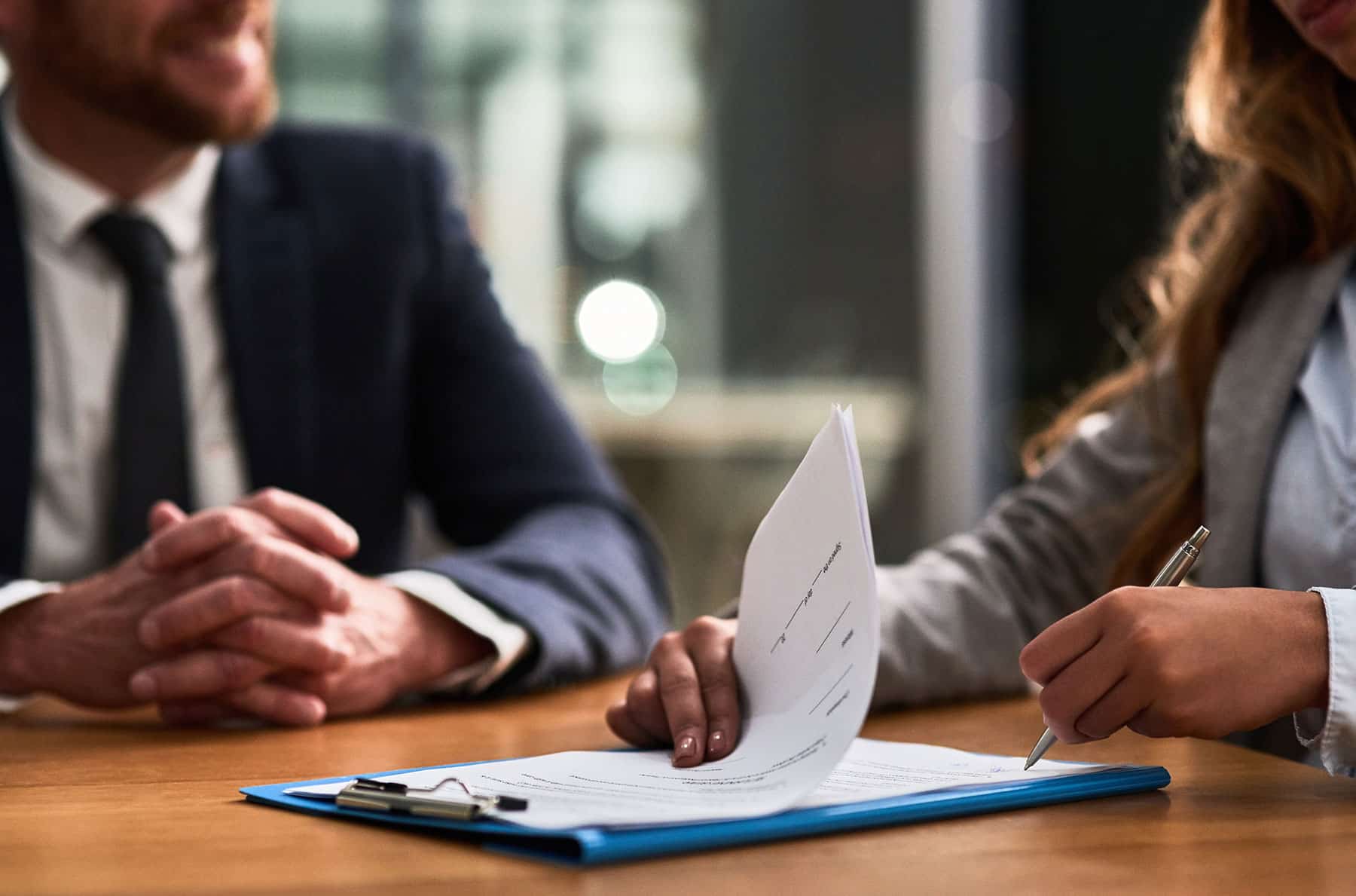 Woman Signing Insurance Paper