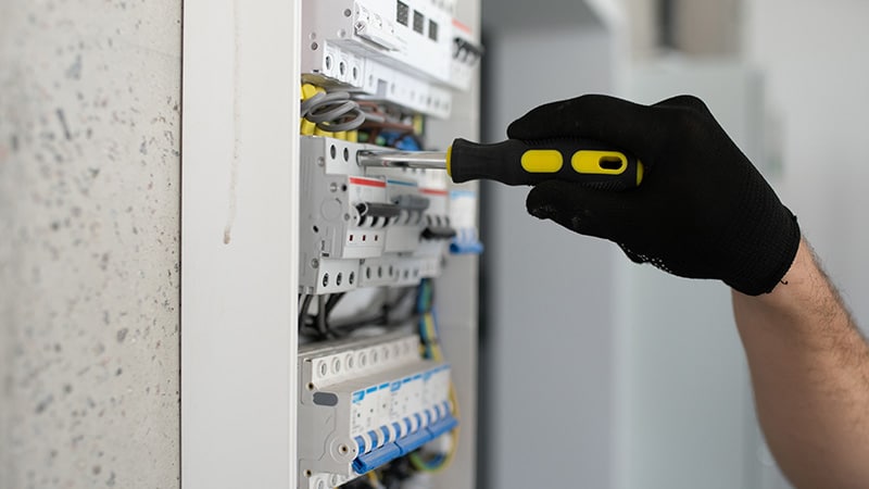 maintenance service worker repairing breaker