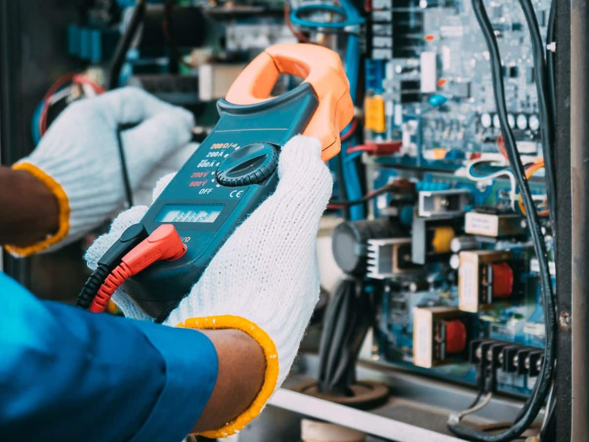 maintenance worker checking breaker power