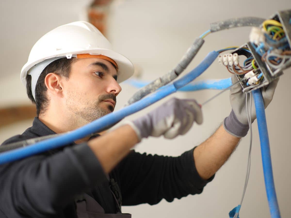 maintenance worker checking cord breaker
