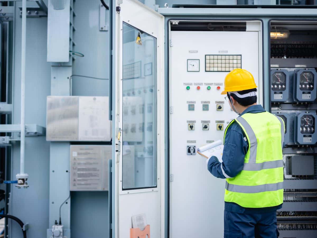 maintenance worker fixing ligjts