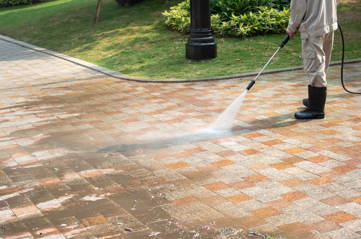 maintenance worker pressure washing
