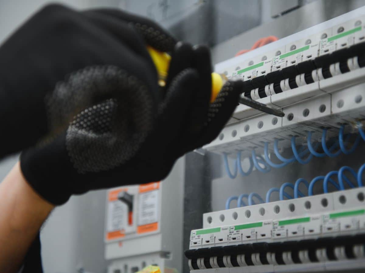 maintenance worker testing breaker