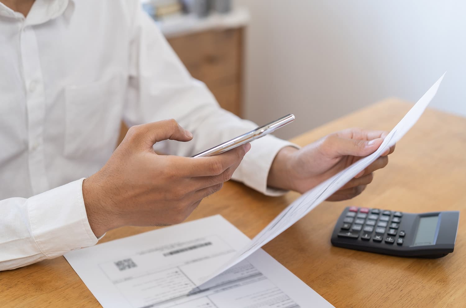 man checking current invoice