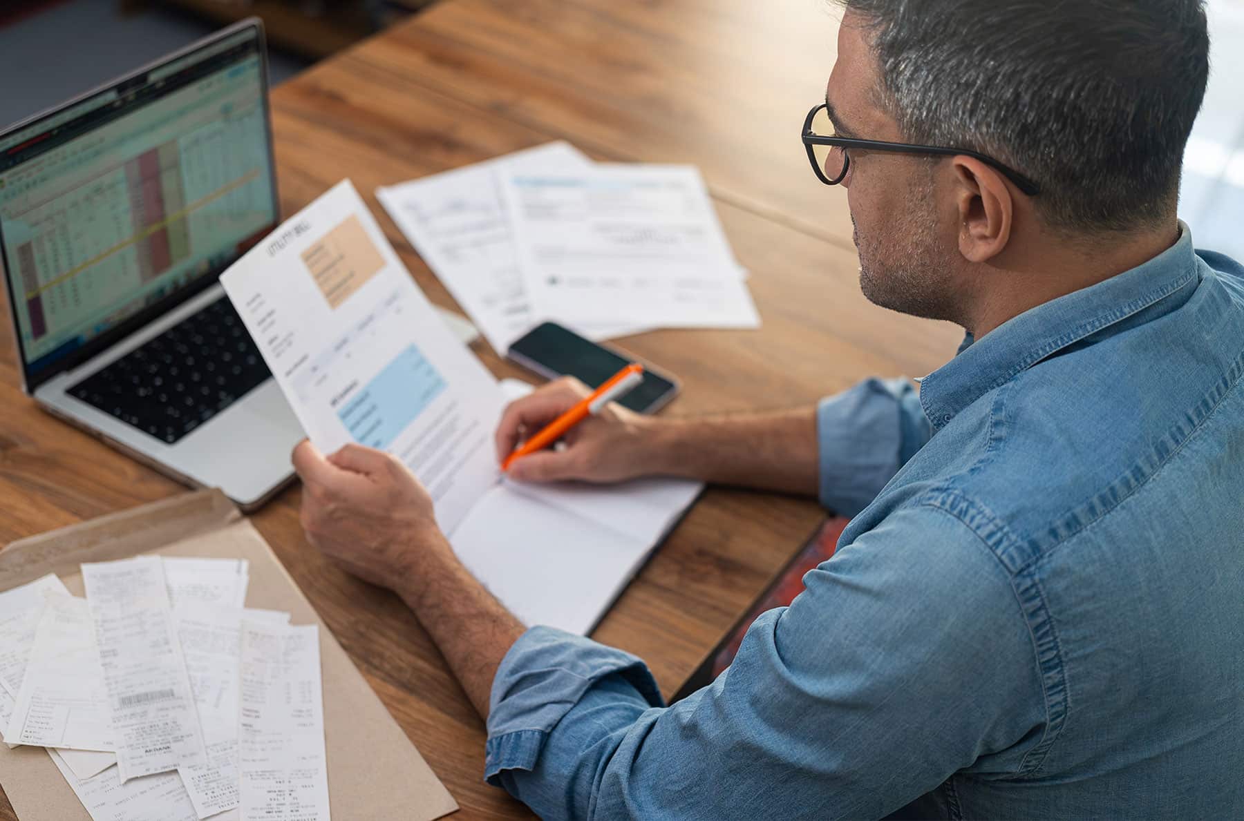 man in billing department checking invoices
