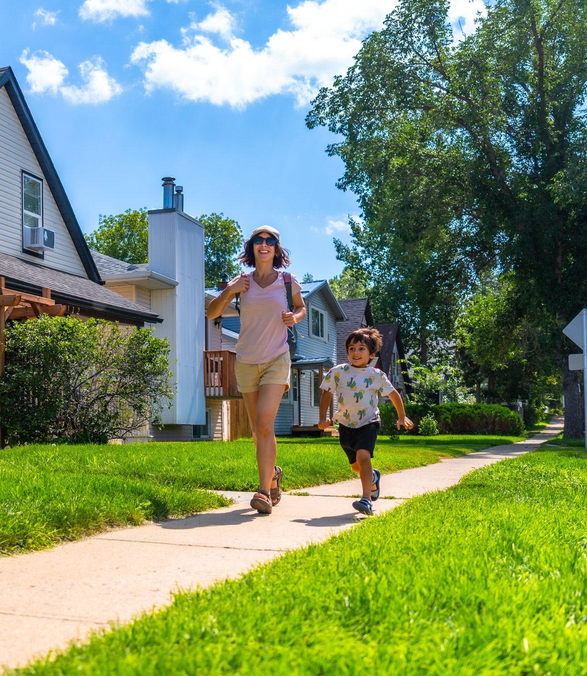 neighborhood residents walking along sidewalk