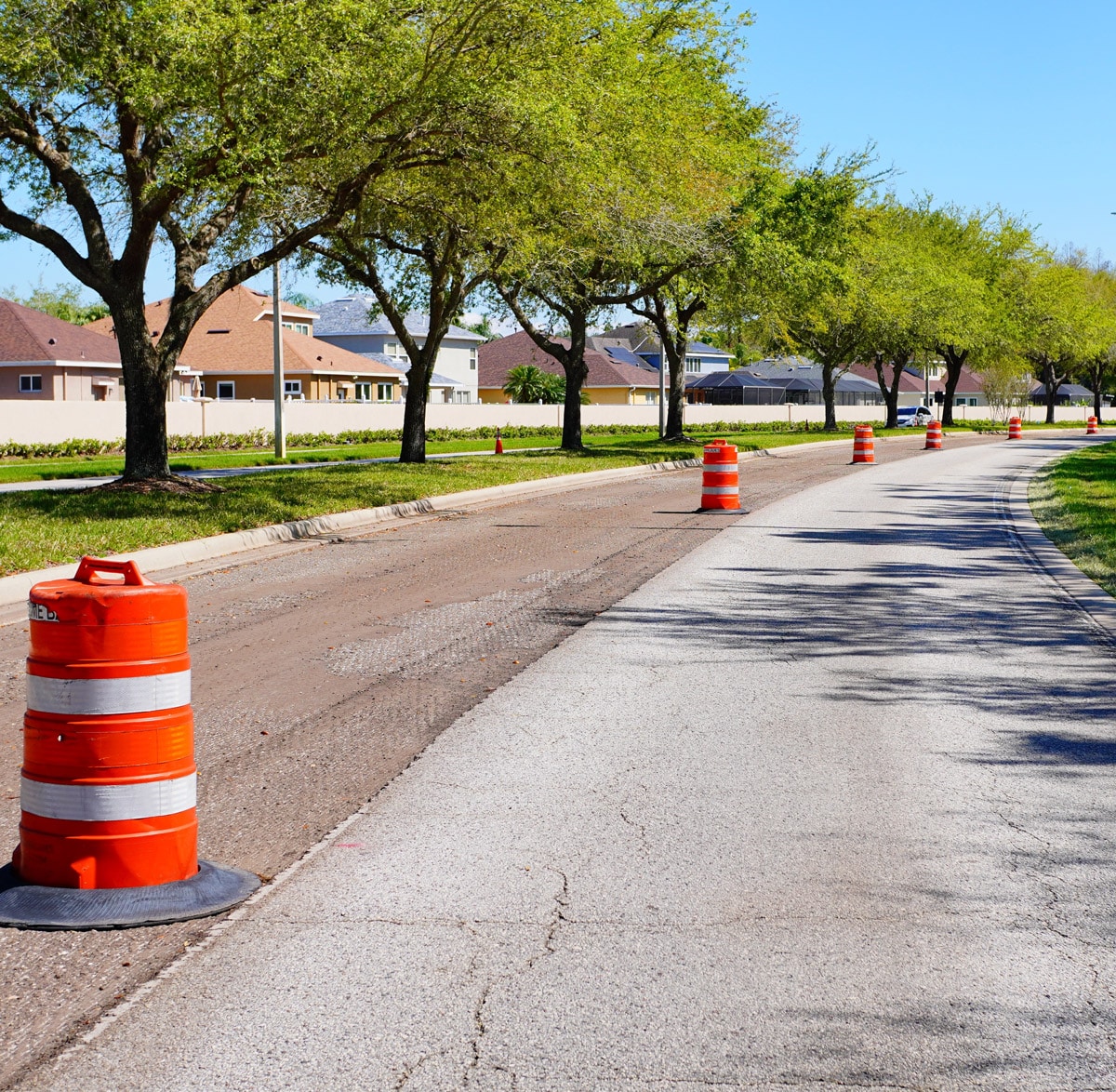 neighborhood street with orange cones