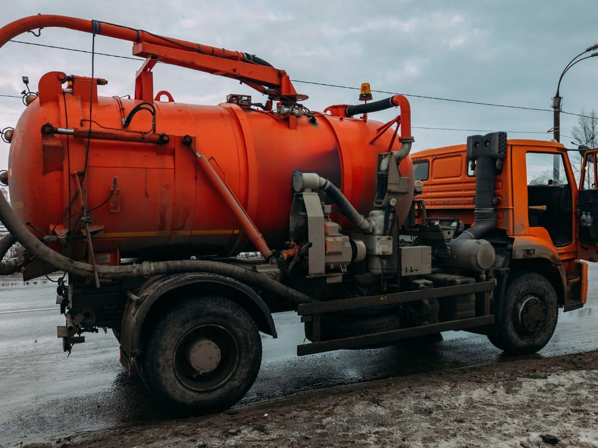 orange vacuum truck in nedighborhood