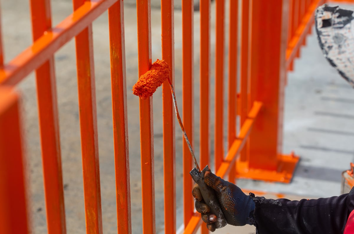 painter painting fence