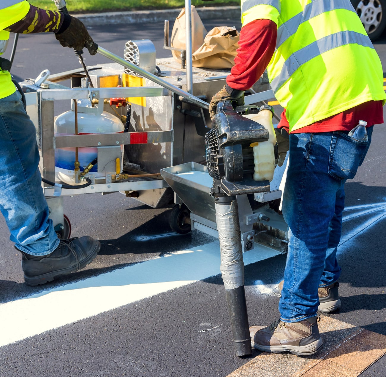 road maintenance worker repairing street
