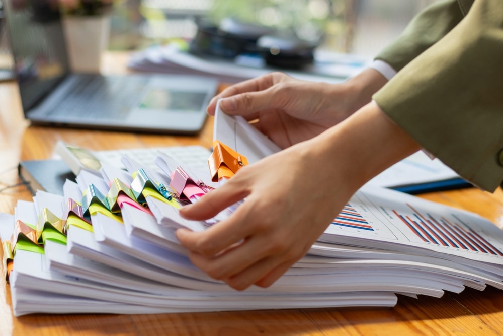 stacks of documents being organized