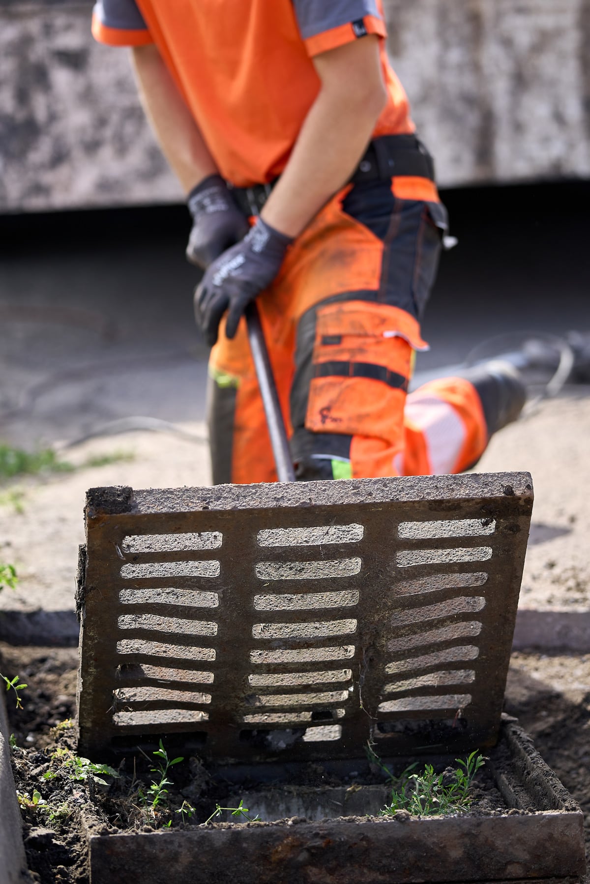 storm drain cleaning worker