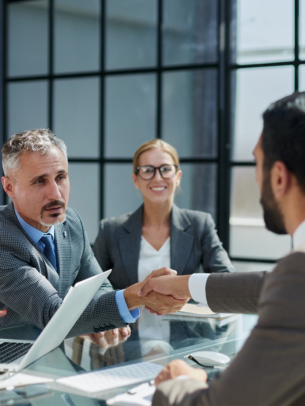 two board members shaking hands