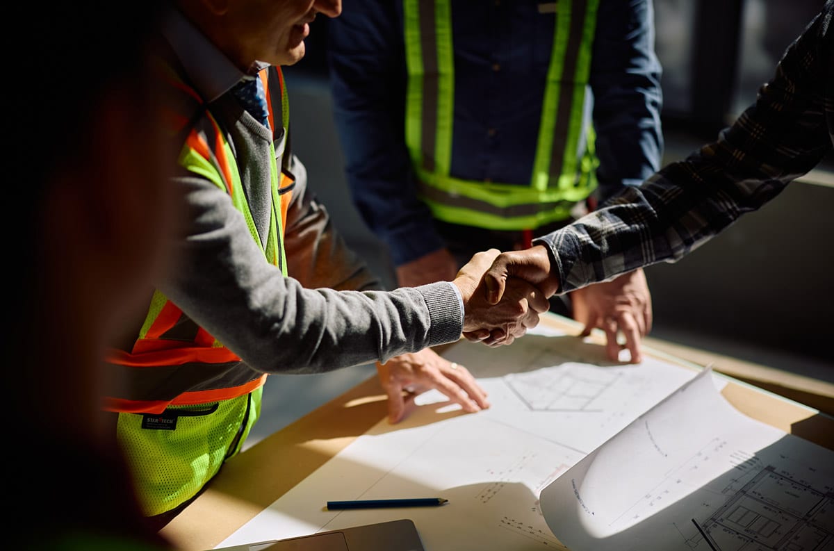 two construction workers builder compliance