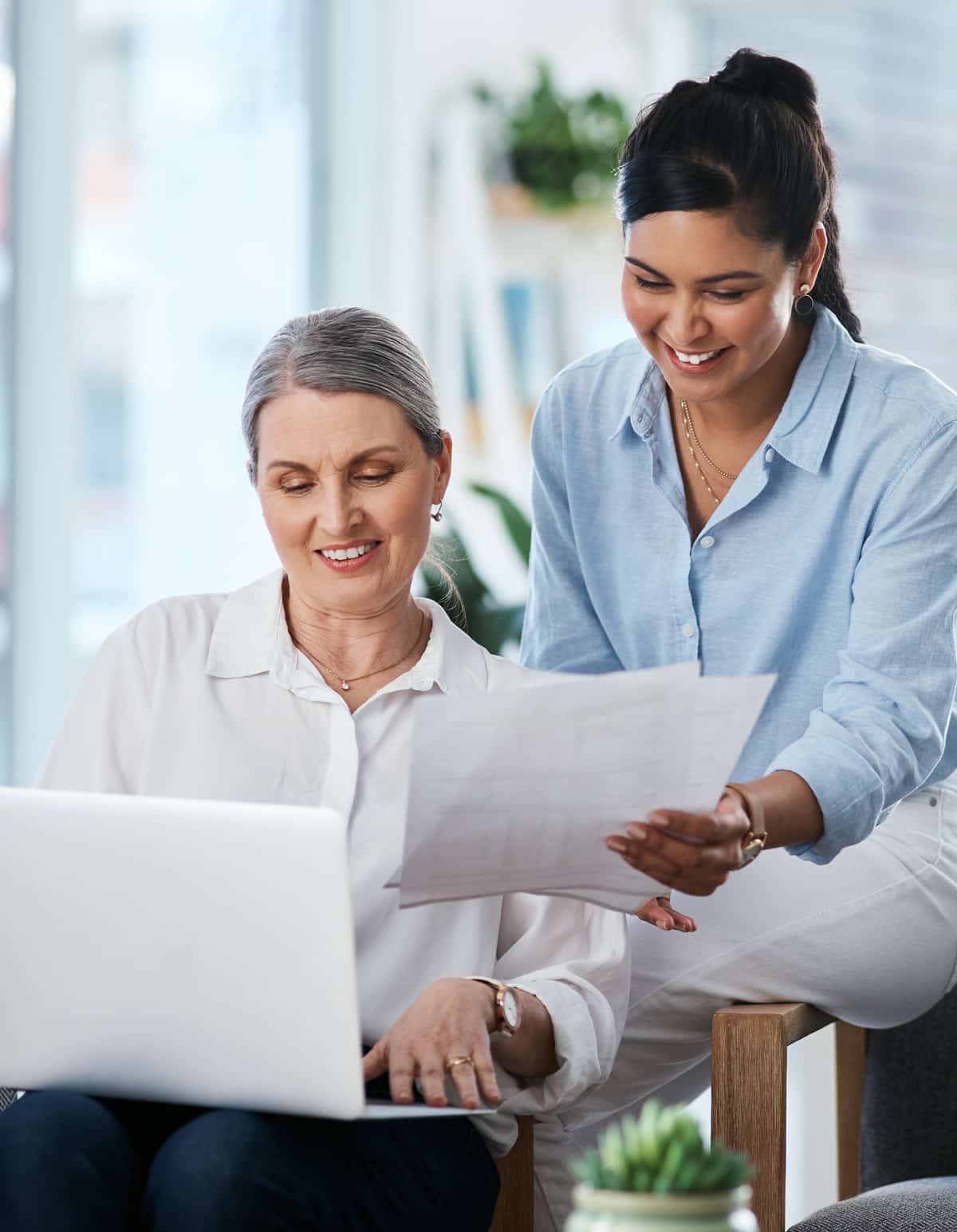two financial auditor smiling