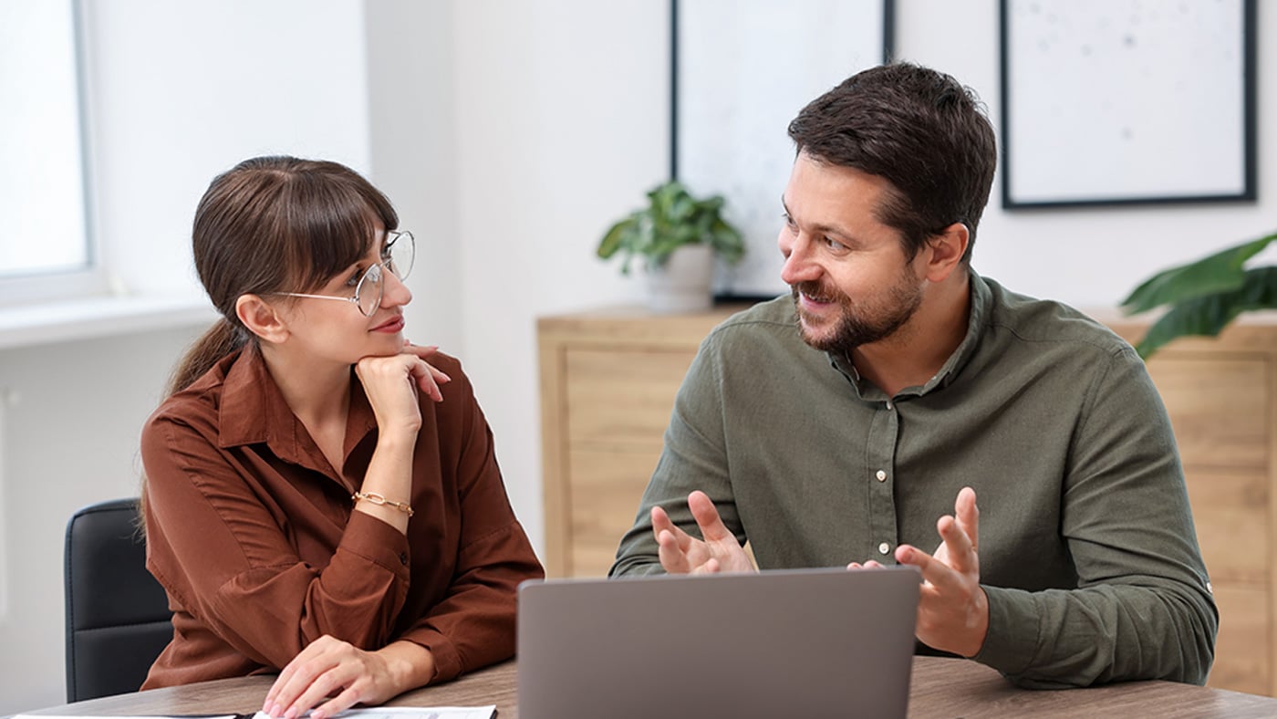 two financial fund planners talking