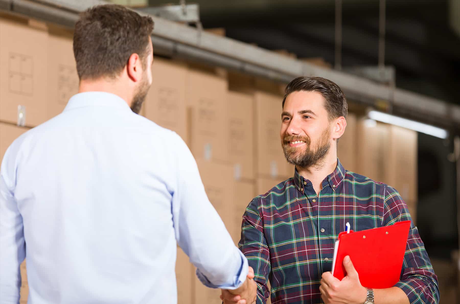 two male vendors shaking hands