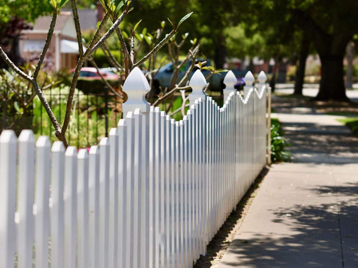 white picket fence in neighborhood
