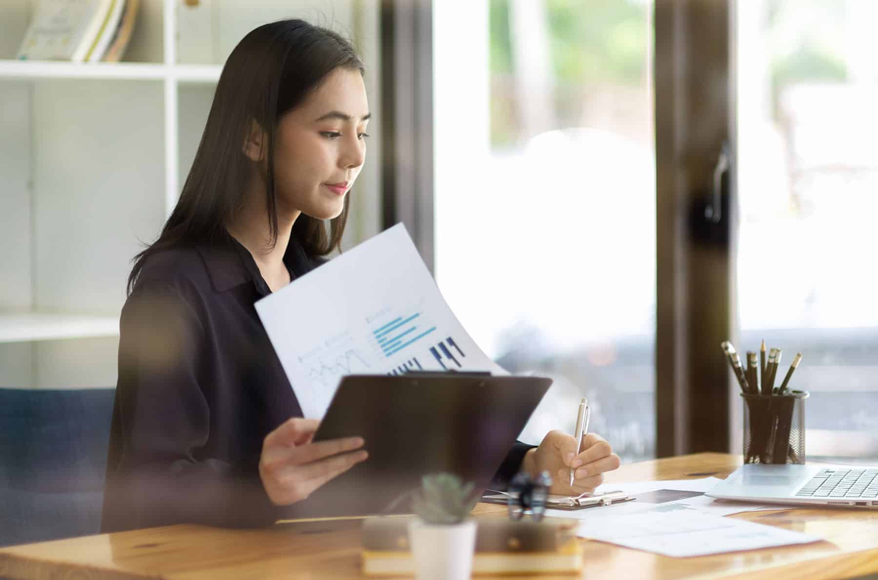 woman checking cash flow documents