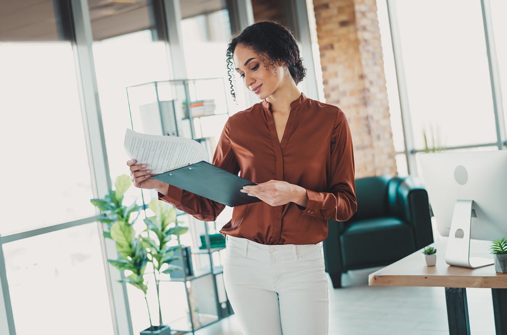 woman holding financial documents