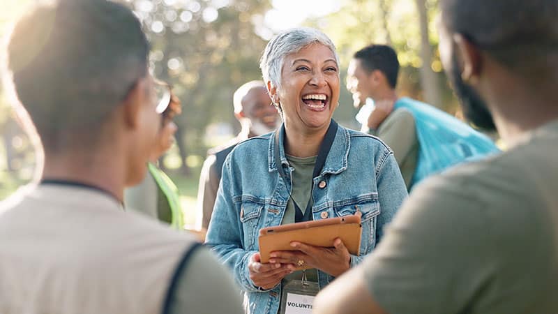 woman laughing with event guests