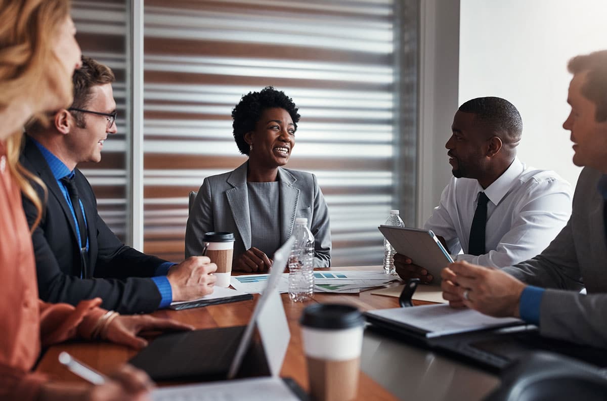 woman smiling talking to board member